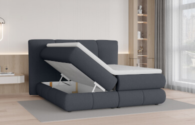 tapicerowane łóżko kontynentalne z dwoma materacami i dekoracyjnie przeszywanym zagłówkiem