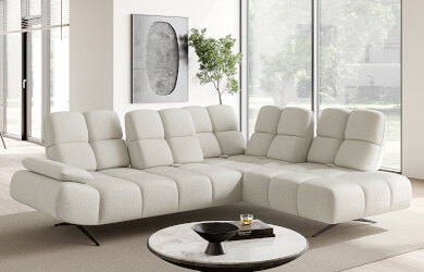 naroznik typu L do salonu na wsyokich nozakch z przeszywanym dekoracyjnie siedziskiem i oparciem i regulacją głebokosci siedzisk