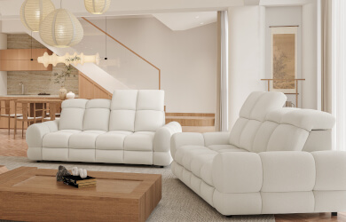 sofa z zaobleniami i eleganckim pikowaniaem oraz przeszyciami, posiada regulowane zagłówki