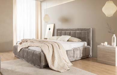 szare łóżko tapicerowane z eleganckimi pionowymi przeszyciami