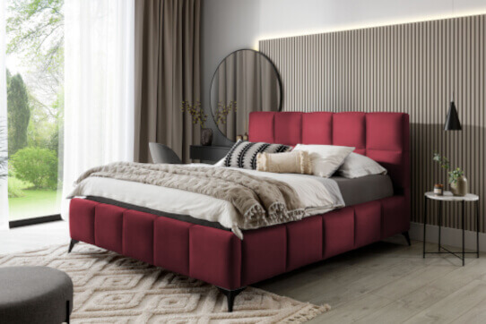 Eleganckie i wygodne łóżka tapicerowane w nowoczesnych aranżacjach z pionowymi przeszyciami boków i geometrycznie podzielonym wezgłowiem